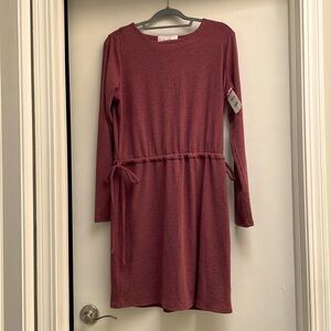 Charlene Henry Size Medium, mid length dress comes to just above the knee.